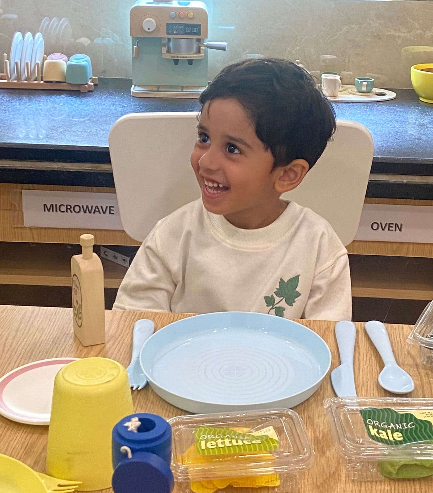 A child smiling at Little Ivy Preschool